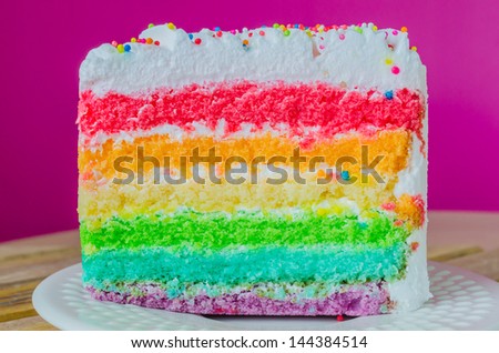 Rainbow cake in white dish