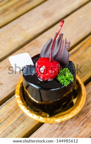 Chocolate cake with cherry on top
