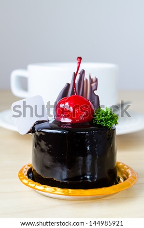Chocolate cake with cherry on top