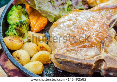 Pork steak in hot pan