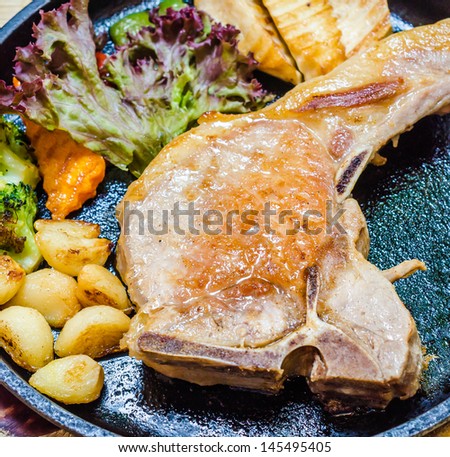 Pork steak in hot pan