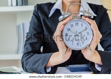 Young business women with clock