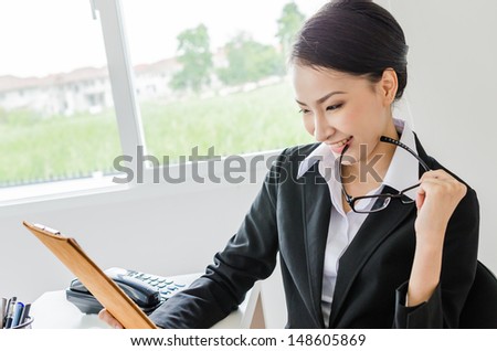 Business women thinking in office