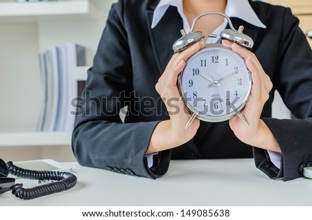 Young business women with clock
