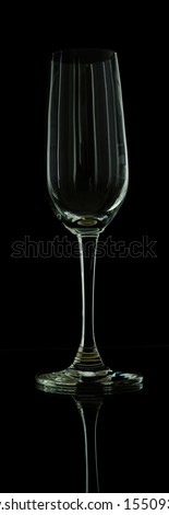 Wine glass on black wallpaper