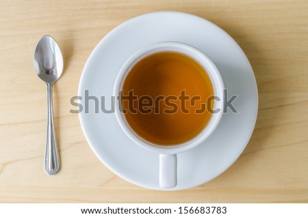 white tea cup&spoon on the wood table (Bird eye view)