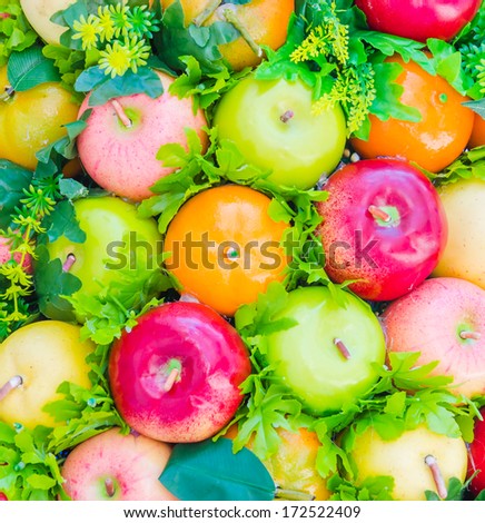 Fake plastic fruit background