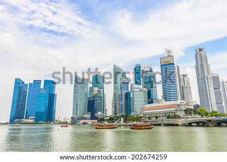 SINGAPORE - JUNE 22: Urban landscape of Singapore. Skyline and modern skyscrapers of business district Marina Bay Sands at most financial developing Asian city state. Singapore, JUNE 22, 2014