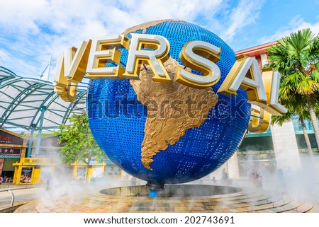 SINGAPORE - JUNE 25: Tourists and theme park visitors taking pictures of the large rotating globe fountain in front of Universal Studios on JUNE 25, 2014 in Sentosa island, Singapore