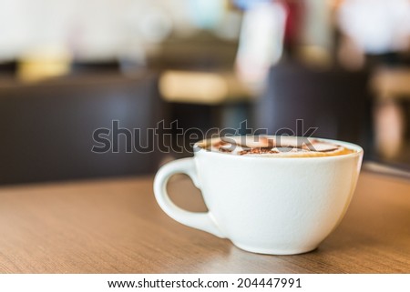 Coffee cup in coffee shop interior