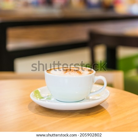 Coffee cup in coffee shop interior