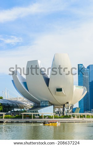 SINGAPORE, SINGAPORE - JUNE 25: The skyline of Singapore lit up at night with the ArtScience Museum in the foreground. Photo taken June 25, 2014 in Singapore, Singapore.