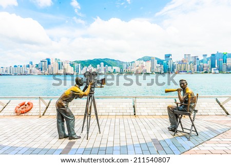 HONG KONG, CHINA - August 14: Statue and skyline in Avenue of Stars on August 14 2014 in Hong Kong, China. The promenade honours celebrities of the Hong Kong film industry as the famous attraction.