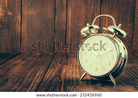Clock on wood background - vintage effect style pictures