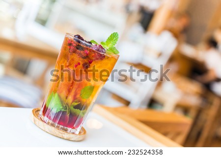 Fruits juice cocktail mixed with mint , lime , blueberry , berry