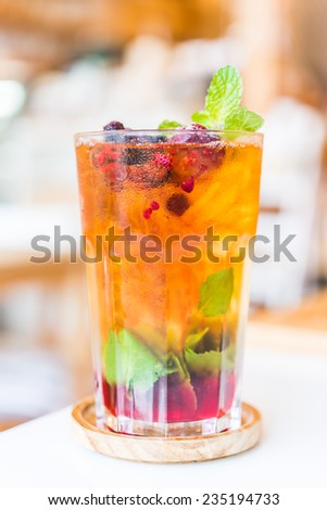 Fruits juice cocktail mixed with mint , lime , blueberry , berry