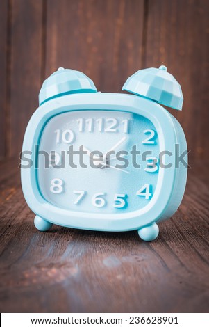 Clock on wood background