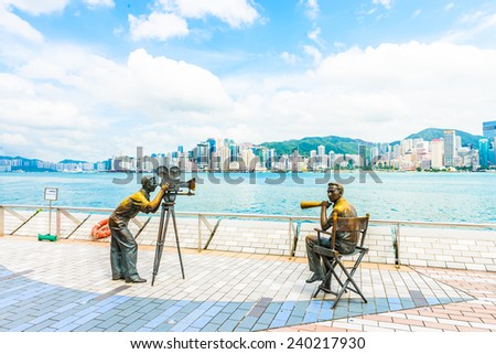 HONG KONG, CHINA - August 14: Statue and skyline in Avenue of Stars on August 14 2014 in Hong Kong, China. The promenade honours celebrities of the Hong Kong film industry as the famous attraction.