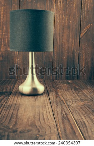 Lamp on wood background - vintage effect style