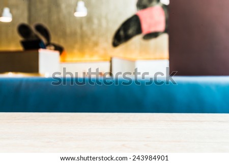 Wood table space on blur restaurant background