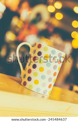 Coffee cup on wooden table in coffee shop cafe - Vintage effect style pictures