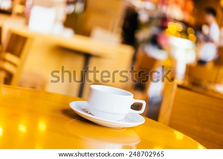 Coffee cup on wooden background - vintage effect pictures