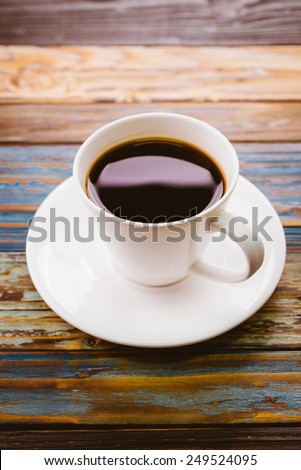 Coffee cup on wooden table - vintage effect pictures