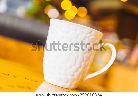 Coffee cup in coffee shop on wooden table - Vintage effect style pictures