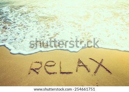 Wave sea water on the beach with relax word - vintage effect style pictures