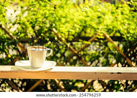 Outdoor Coffee cup with sun light - vintage effect process style pictures