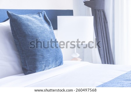 Bed pillow in luxury hotel - vintage film tone effect style processing