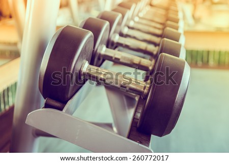 dumbbell in gym vintage effect and sun flare filter effect dumbbell in gym vintage effect and sun flare filter effect