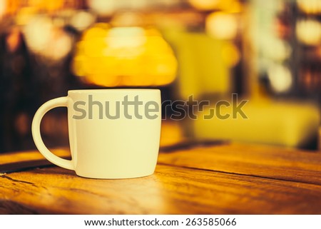 Latte coffee cup on table in coffee shop - Vintage old effect processing picture style