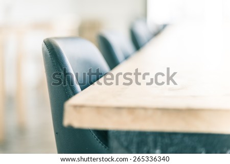 Selective soft focus point on chair in coffee shop - vintage effect