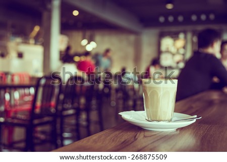 Coffee cup in coffee shop - vintage filter