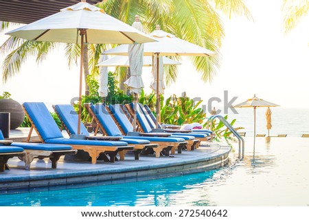 Hotel resort pool on sunrise time - vintage filter and sunflare effect