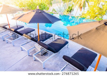 Umbrella pool chair - vintage filter and sunflare effect