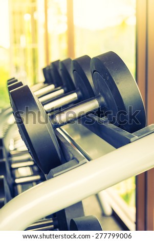 Selective soft focus point on Dumbbell - vintage filter and sunflare effect