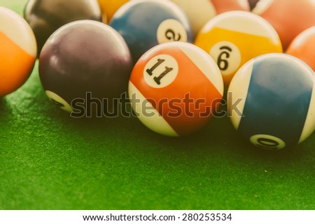 Pool billiards balls on pool table - vintage filter