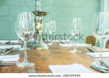 Selective focus on Wine glass on table dinner in restaurant - filter effect