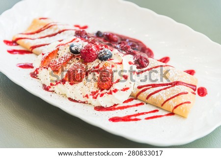 Selective focus point on Dessert berry fruit crepe