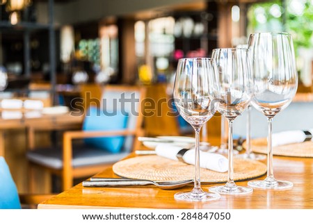 Selective soft focus on Wine glass on dining table in restaurant