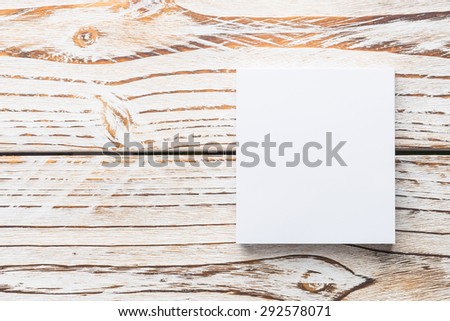 Blank white paper mock up on white wood background - filter effect