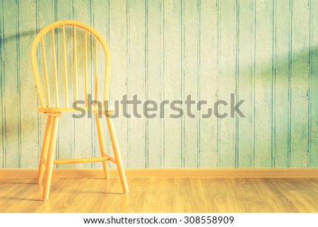 Vintage wood chair on wood background with copy space - vintage filter effect