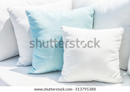 Pillow on sofa bed with outdoor view