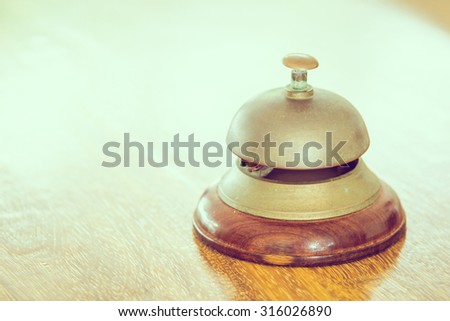 Vintage service bell at hotel reception - vintage filter