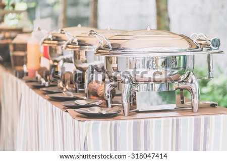 Selective focus point on Catering buffet food in restaurant - Light vintage filter effect