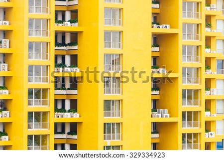 Yellow window pattern at apartment building - vintage filter