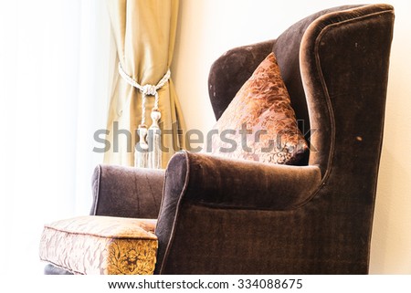 Pillow on sofa with light lamp decoration of living room interior