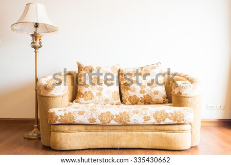 Pillow on sofa with light lamp decoration of living room interior